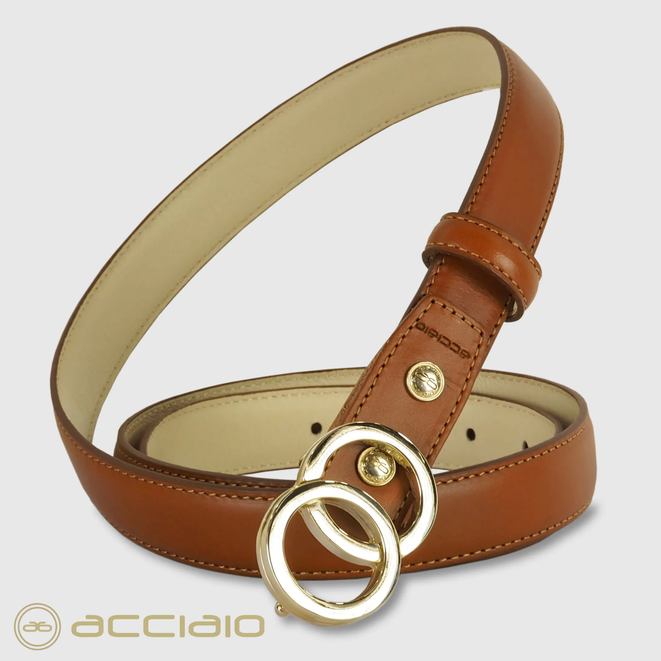 cintura_donna_sottile_in__0-2.webp Cintura donna sottile in pelle Eclipse Oro cuoio Cognac